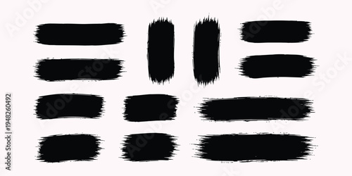 A collection of 12 black brush strokes on a white background