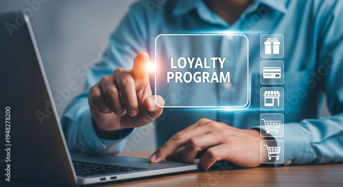 A man interacting with a loyalty program on his laptop