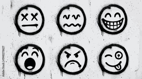 Set of black spray painted graffiti emoji faces with different expressions on textured wall background, concept for street art decoration, urban social media content and emotional messaging