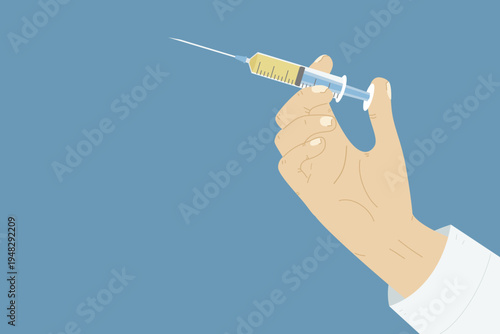 Hand of a doctor holding a syringe with yellow medication for vaccination 