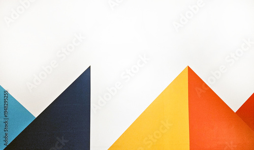 Colorful geometric shape on a background or wallpaper. Abstract of white, blue, yellow, black, red and orange wall.