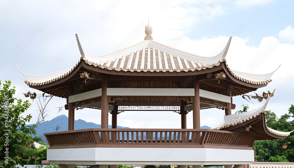 Fototapeta premium An ornate brown and white gazebo sits with peaked roofs under a cloudy, soft blue sky in a natural outdoor setting