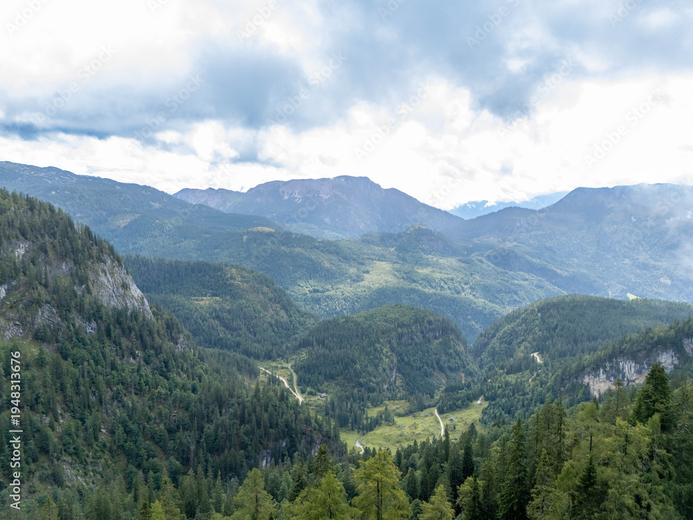 Fototapeta premium Aerial View of the Austrian Alps in Near Grundlsee With Alpine Forests on a Overcast Day