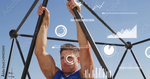 Vertical video: HUD activating, man in blue tank top gripping dome bars and monitoring data at park