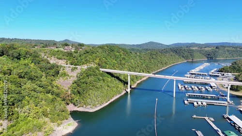 Wallpaper Mural Aerial View of the Lakeside Sunset Marina Resort on Dale Hollow Lake With Highway 111 Bridge, Boats and Forested Shoreline, Calm Water on a Sunny Day, Monroe, Tennessee, USA. Torontodigital.ca