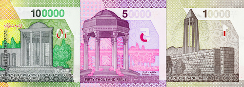Iranian Rial banknotes showing architectural landmarks and denominations. Concept of Iran's national currency.