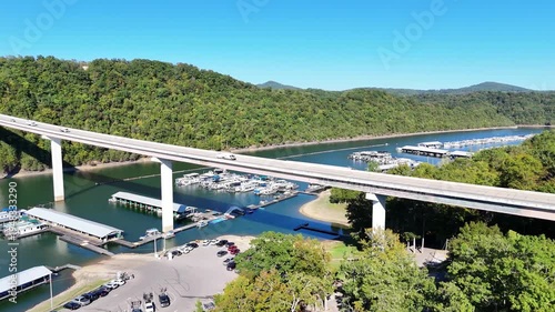 Wallpaper Mural Aerial View of the Lakeside Sunset Marina Resort on Dale Hollow Lake With Highway 111 Bridge, Boats and Forested Shoreline, Calm Water on a Sunny Day, Monroe, Tennessee, USA. Torontodigital.ca