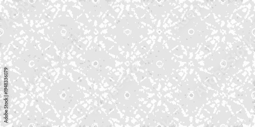 Abstract grayscale texture with scattered circles and grainy speckles