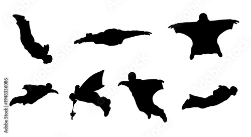 Black silhouette of people in wingsuits flying