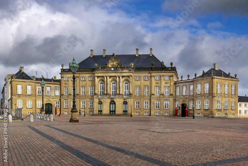 Facade of one of the Amalienborg Palace buildings on Royal Square, Copenhagen, Denmark. Historic Rococo architecture