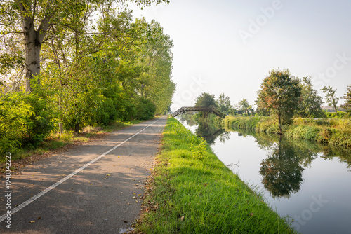 Billede på lærred Via Alzaia Pavese along the Naviglio Pavese canal near Certosa di Pavia, provinc