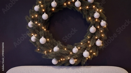 Festive Holiday Wreath with White Baubles on Dark Modern Wall