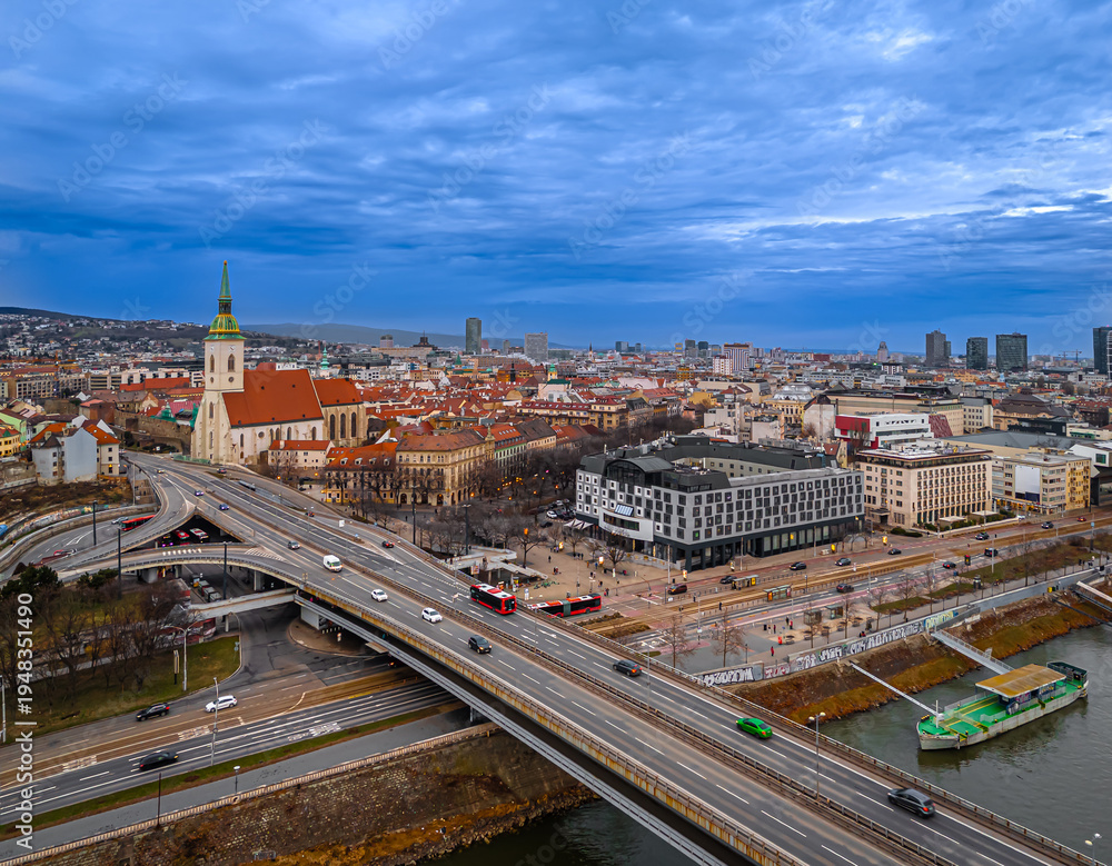 Obraz premium Bratislava night skyline with St Martins Cathedral bridge and reflections