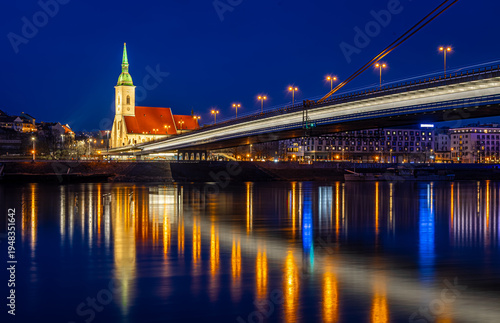 Canvas Print Bratislava night skyline with St Martins Cathedral bridge and reflections