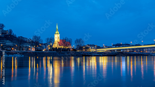 Photography Bratislava night skyline with St Martins Cathedral bridge and reflections