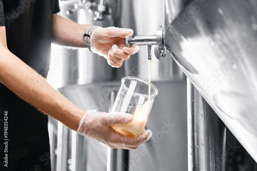 Cuadro en lienzo Beer production process in factory, brewing equipment and quality control