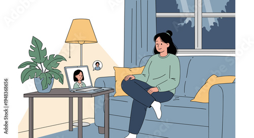A woman sits on a couch, video calling another person on her laptop.