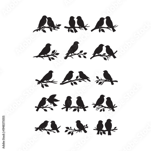 black silhouettes of birds on tree branches