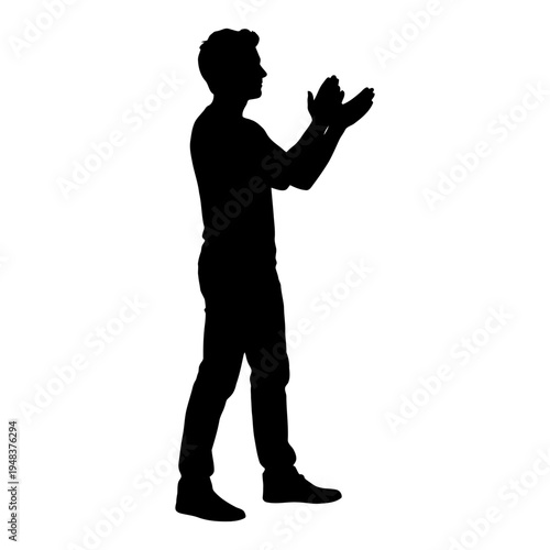 Silhouette of a man standing and clapping his hands to show appreciation, support, and celebration of success.