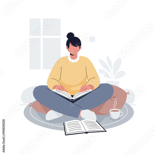 Woman reading book sitting cross-legged.