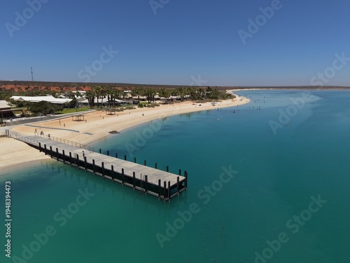Wallpaper Mural Aerial View of Monkey Mia Dolphin Resort Beach, Jetties and Turquoise Water Along a Quiet Coastal Resort Village, Denham, Francois Peron NP, Shark Bay, Western Australia. Torontodigital.ca