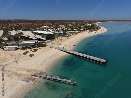 Wallpaper Mural Aerial View of Monkey Mia Dolphin Resort Beach, Jetties and Turquoise Water Along a Quiet Coastal Resort Village, Denham, Francois Peron NP, Shark Bay, Western Australia. Torontodigital.ca
