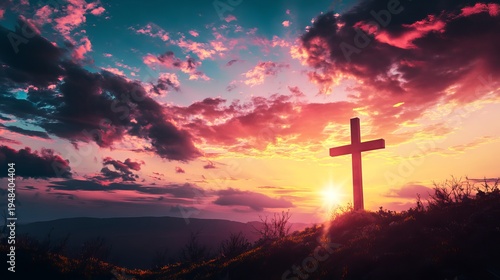 A serene landscape of a cross on a hill at sunset with vibrant colors in the sky