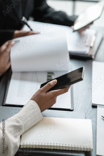 Financier group brainstorms project solutions during team meeting