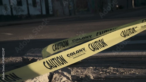 Slow motion shot of caution tape on a city street