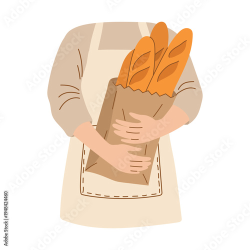 Baker in an apron holding a bag of fresh baguettes