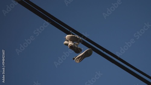 Sneakers hanging on a power line.