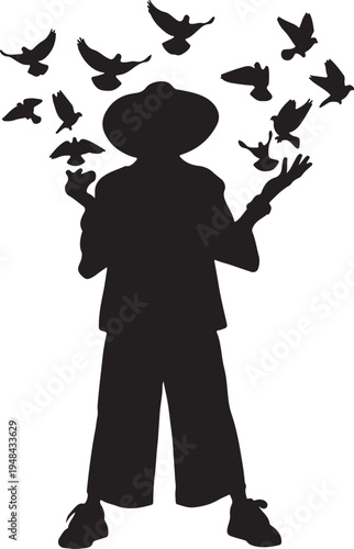 Silhouette of a person feeding birds with outstretched arms under a flock of flying birds