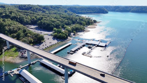 Wallpaper Mural Aerial View of the Lakeside Sunset Marina Resort on Dale Hollow Lake With Highway 111 Bridge, Boats and Forested Shoreline, Calm Water on a Sunny Day, Monroe, Tennessee, USA. Torontodigital.ca