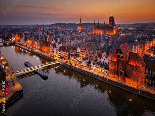 Beautiful old town of Gdansk with historic architecture over the Motlawa river at dusk, Poland