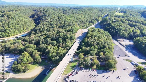 Wallpaper Mural Aerial View of the Lakeside Sunset Marina Resort on Dale Hollow Lake With Highway 111 Bridge, Boats and Forested Shoreline, Calm Water on a Sunny Day, Monroe, Tennessee, USA. Torontodigital.ca