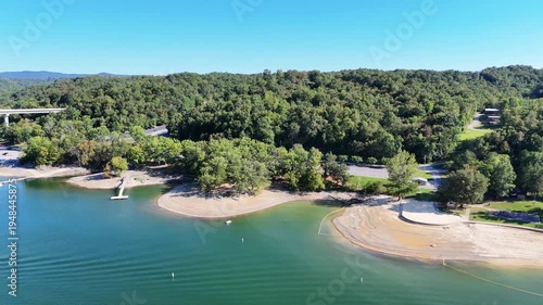 Wallpaper Mural Aerial View of the Lakeside Sunset Marina Resort on Dale Hollow Lake With Highway 111 Bridge, Boats and Forested Shoreline, Calm Water on a Sunny Day, Monroe, Tennessee, USA. Torontodigital.ca