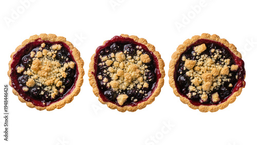 фотографія Three delicious blueberry crumble tarts, freshly baked sweet dessert with golden