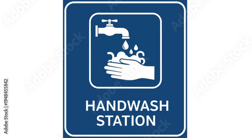 A handwash station sign with a hand and faucet is shown indoors.