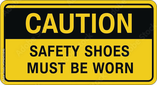 A warning sign displays a caution message about safety shoes in an industrial area.