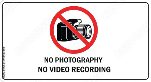 A warning sign with a camera icon prohibits photography and video recording.