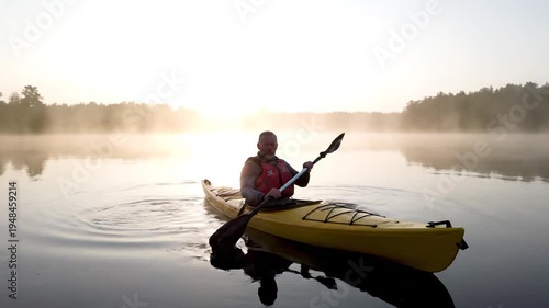 Kayaking on a Misty Lake at Sunrise - A Serene Adventure.