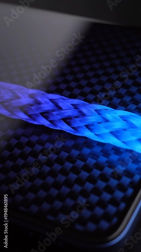 Glowing blue light on carbon fiber.