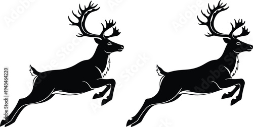 Two black silhouettes of reindeer with large antlers jumping in the air isolated on a white background for winter designs