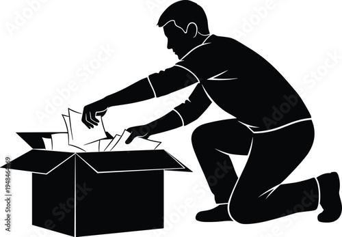 Silhouette of a man kneeling while organizing documents and papers inside a cardboard box for office moving, storage, or logistics business.