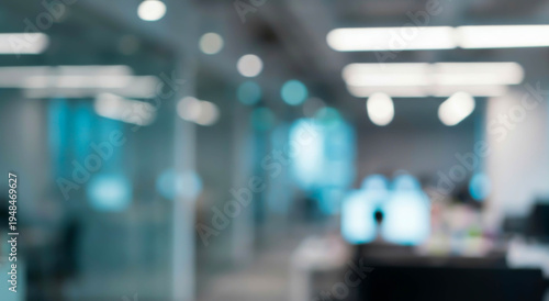 Wallpaper Mural Blurred office interior showcases a modern workspace with computers, desks, and ambient lighting, creating a productive atmosphere that suggests business activities. Torontodigital.ca