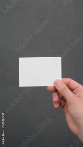 hand holding blank business card