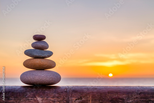 Cairn, outdoors in front of a sunrise.