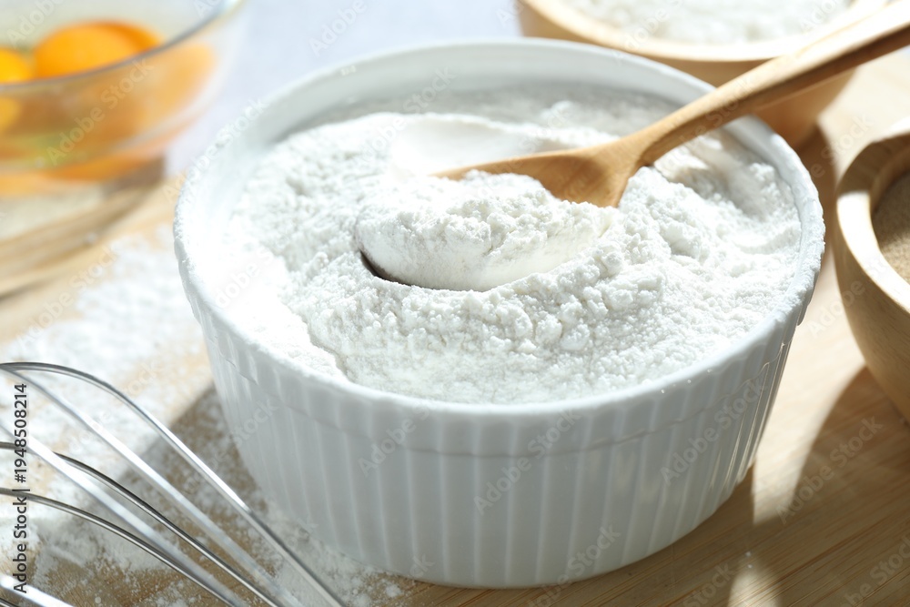 Fototapeta premium Baking powder and other ingredients for making dough on table, closeup