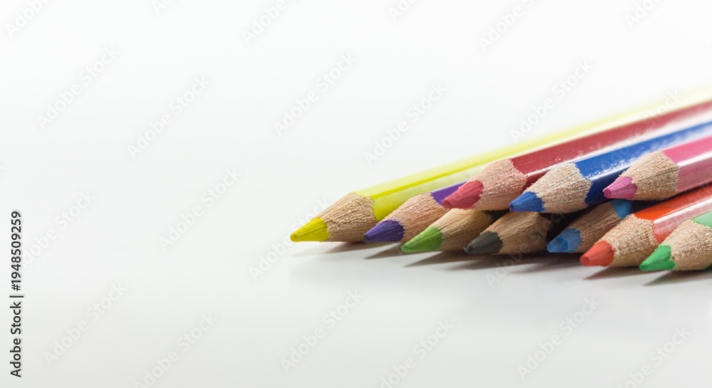 Fototapeta premium Colorful Pencils Arranged on White Background