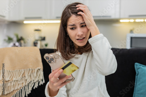 Tableau sur toile Young woman at home tries online buy gets payment fail and card block notice feels panic checks account